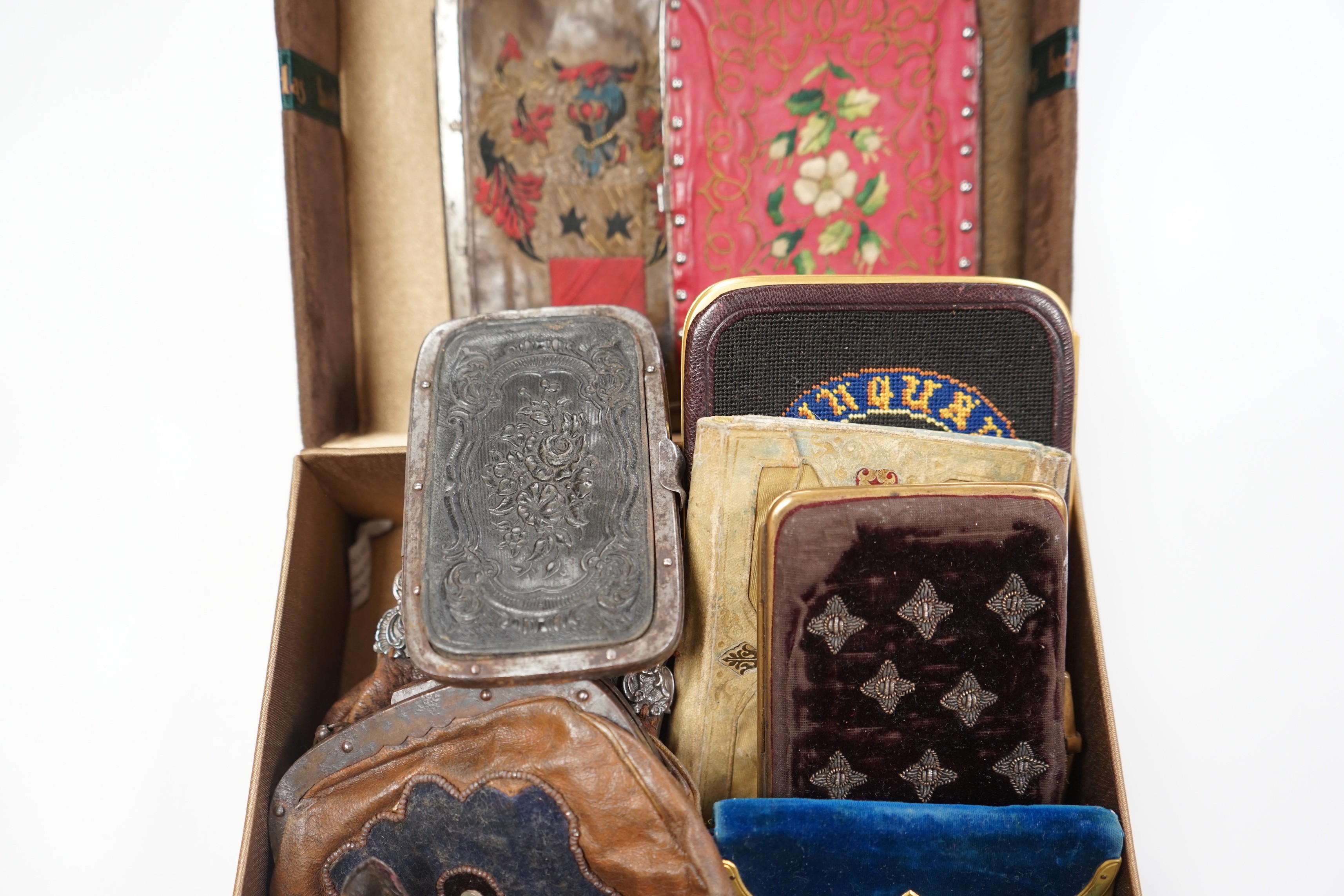 A collection of early 19th century and later embroidered, petite point, leather cut steel and velvet purses card cases etc